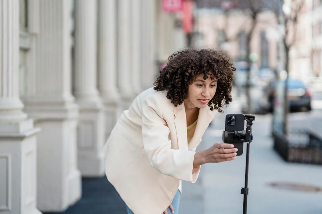 Young girl setting camera on the phone for Instagram reel
